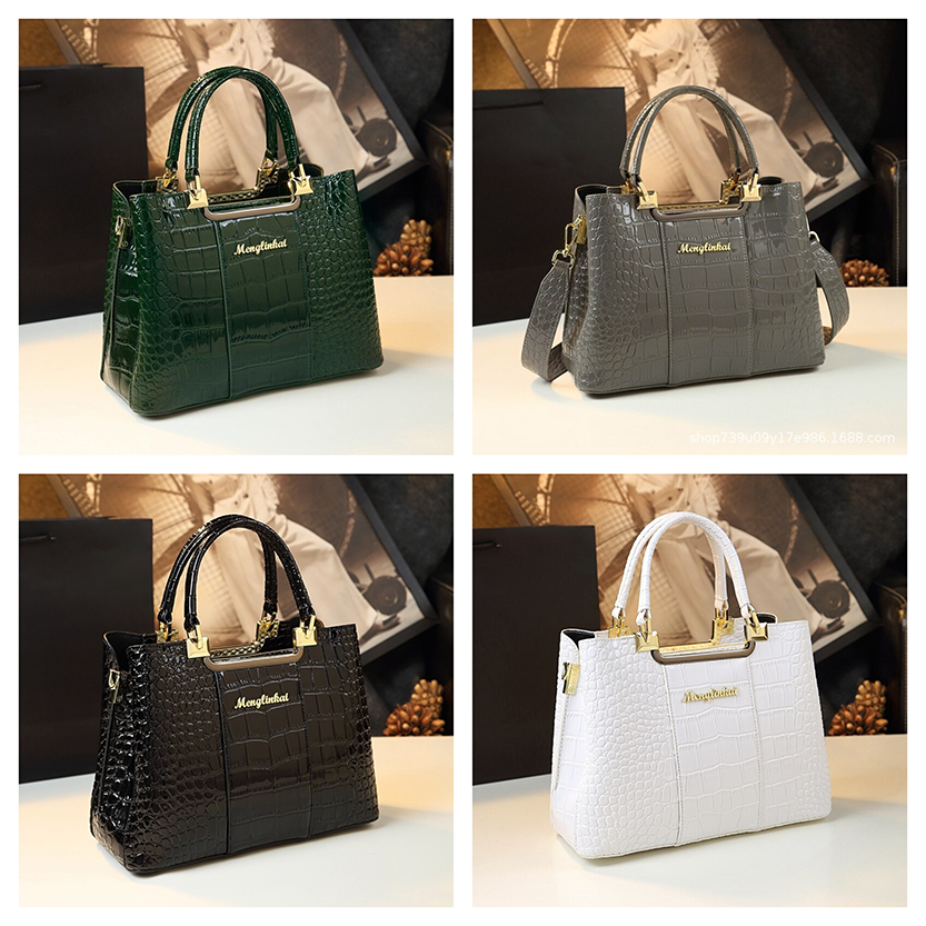 Four stylish handbags in green, gray, black, and white, featuring a textured crocodile pattern and gold accents, showcased on a table.