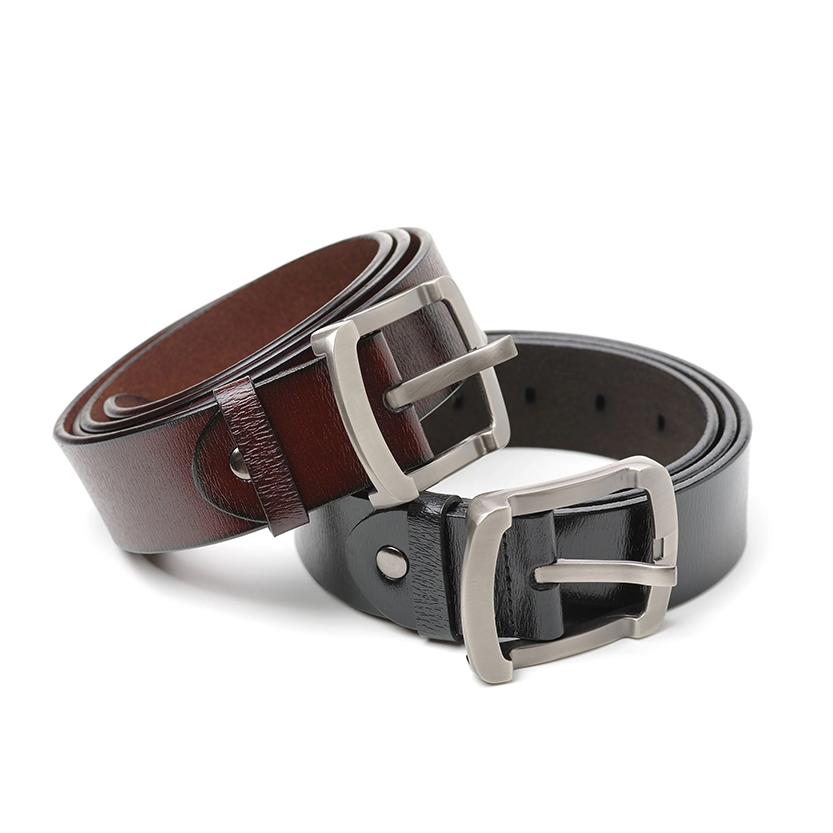 Brown buckle belt resting on black buckle belt
