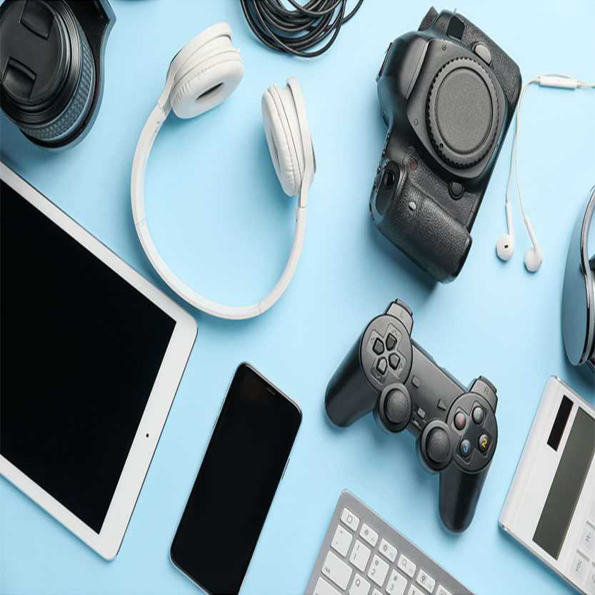 Collection of electronic accessories displayed on a blue tabletop desk.