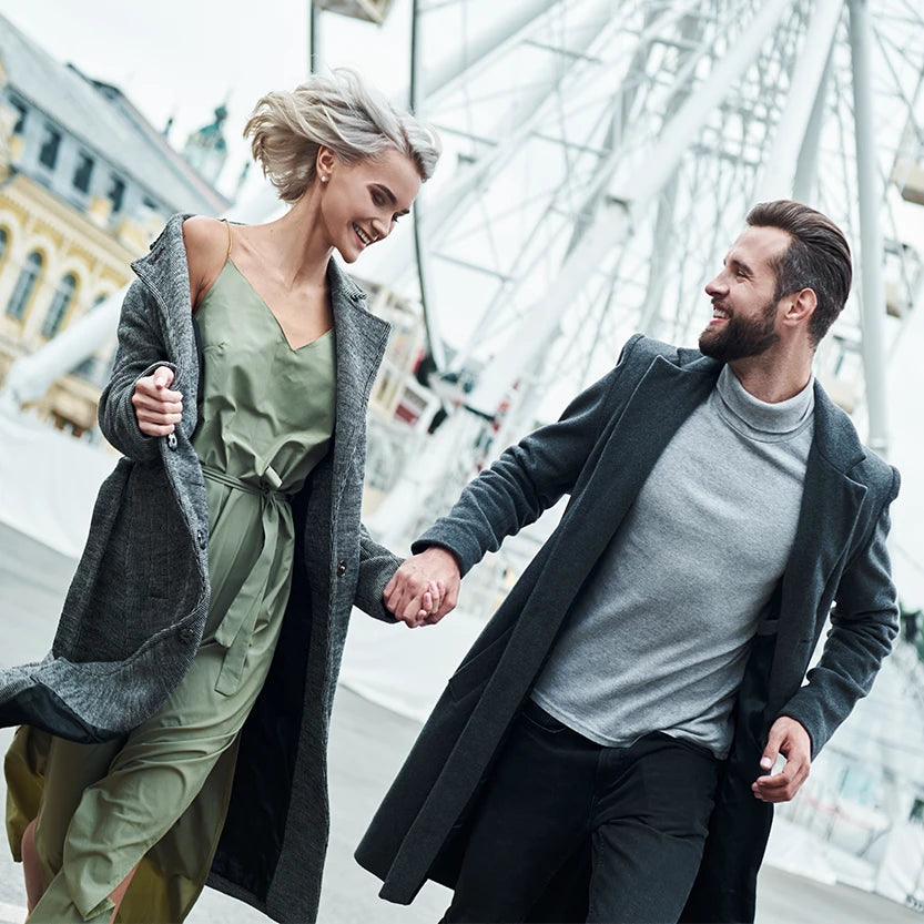 Man and women modelling fashion clothing at fairground