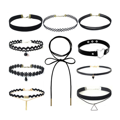 A collection of ten black chokers with varying designs, including lace, pearls, bows, and geometric pendants, arranged on a white background.