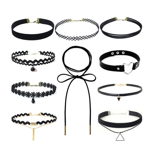 A collection of ten black chokers with varying designs, including lace, pearls, bows, and geometric pendants, arranged on a white background.
