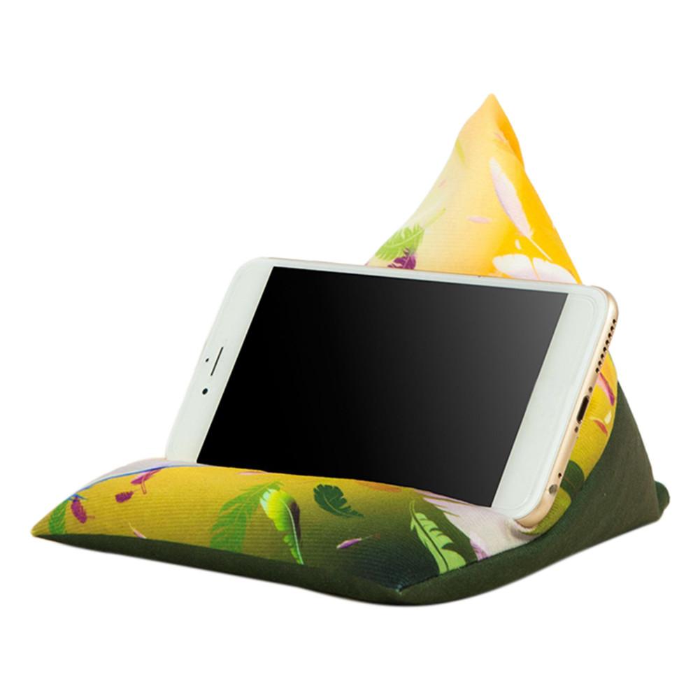 A colorful, triangular phone holder featuring floral patterns, supporting a smartphone in a vertical position.