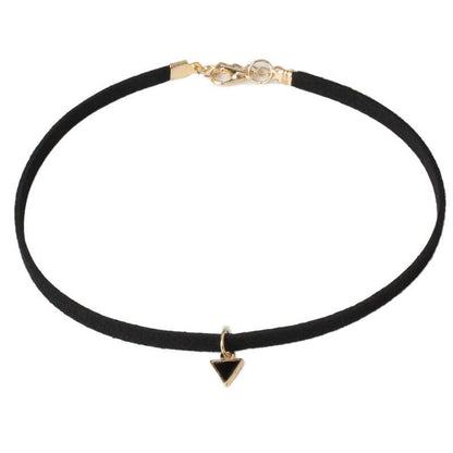 A simple black choker with a gold clasp and a small black triangle pendant hangs at the center. The design is minimalist and elegant.