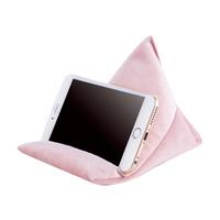 A soft pink triangular phone stand supporting a smartphone, displaying a blank screen. Ideal for hands-free viewing.
