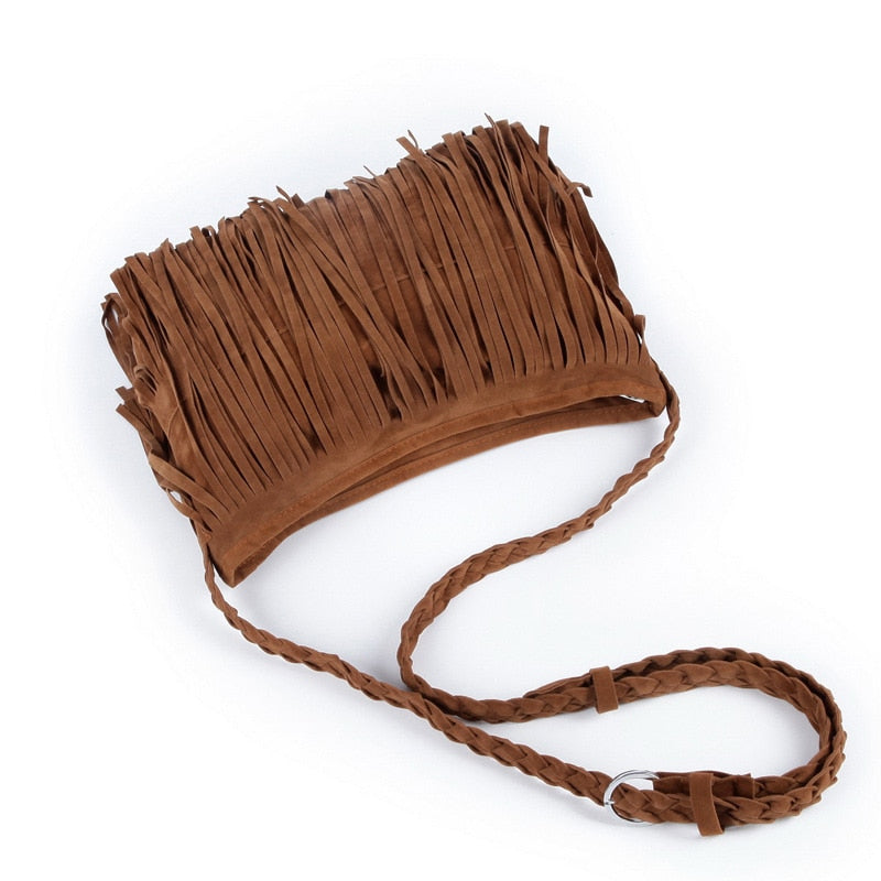 A stylish brown fringe crossbody bag with a braided strap, showcasing a trendy bohemian design. Ideal for casual outings.