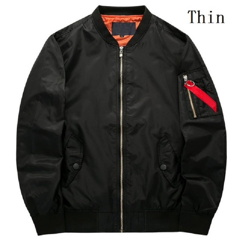 Black bomber jacket with an orange lining, zippered sleeve pocket with a red tag, and front snap button pockets. Text "Thin" in the upper right.