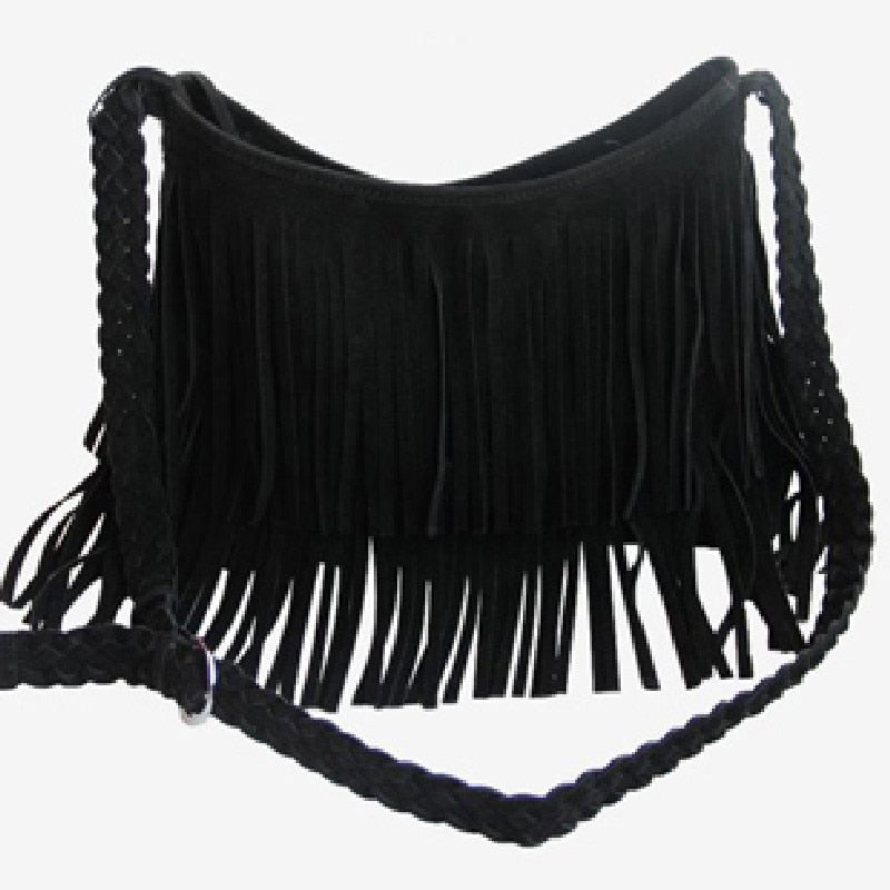 Black suede bag with long fringe detailing, featuring a braided strap for a stylish, bohemian look.