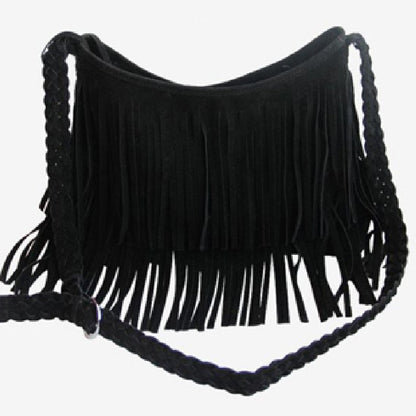 Black suede bag with long fringe detailing, featuring a braided strap for a stylish, bohemian look.
