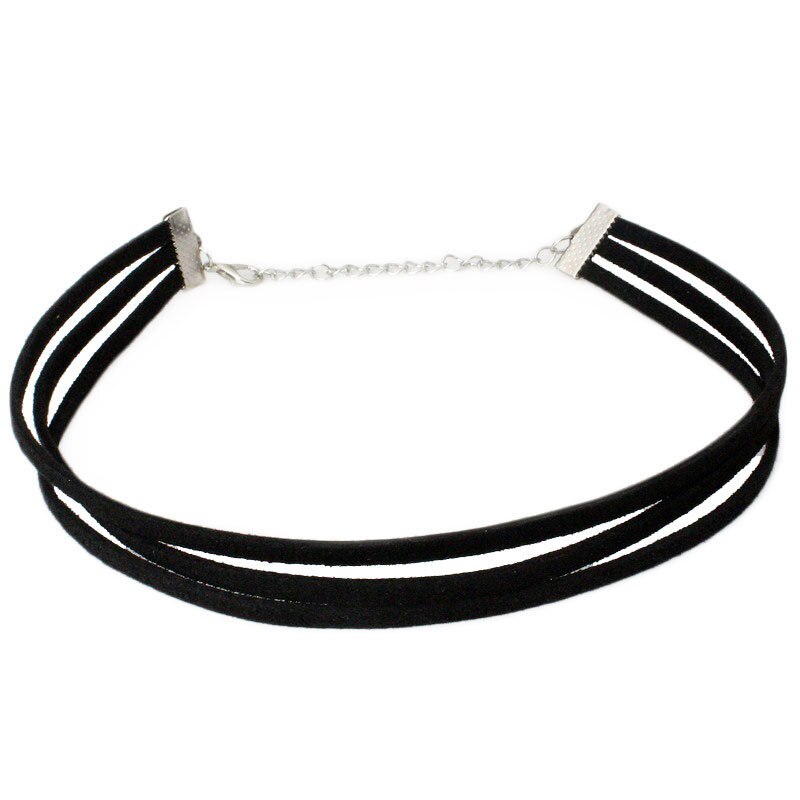 Black velvet choker featuring three strands and a silver adjustable chain clasp. The look is minimalist and elegant, conveying a modern, stylish tone.
