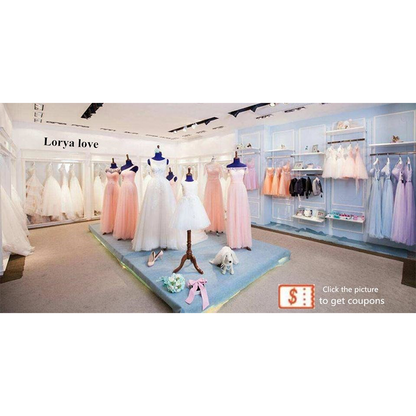 Bridal shop display featuring pastel pink and white dresses on mannequins. Light blue walls with more dresses on racks. Elegant, serene atmosphere.