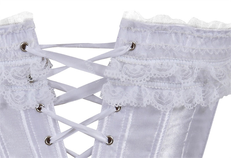 Close-up of a white satin corset with intricate lace trim and crisscrossed white lacing through silver eyelets, conveying elegance and vintage style.
