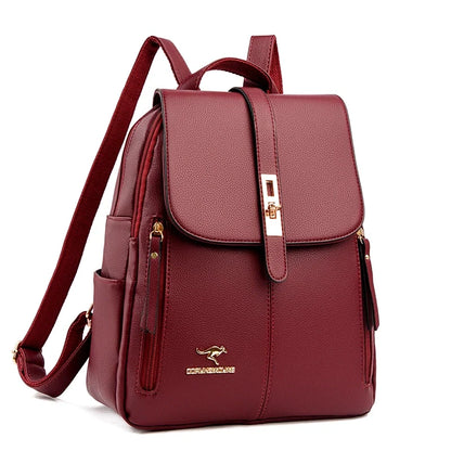 Deep burgundy backpack with a sleek design, featuring a front flap, gold accents, and a kangaroo logo. Ideal for stylish everyday use.