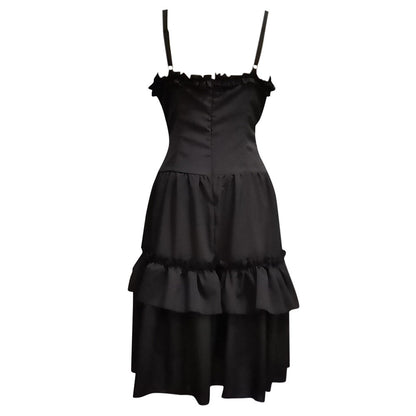 Elegant black dress with thin straps and a ruffled neckline. The fitted bodice flows into a two-tiered layered skirt, conveying a classic, sophisticated tone.