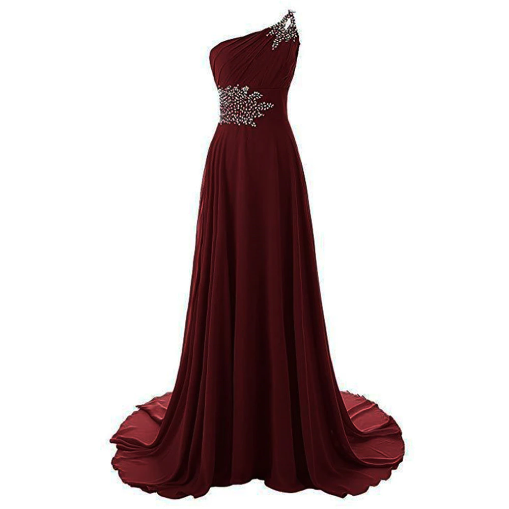 Elegant burgundy one-shoulder dress with a flowing skirt. Features intricate silver embellishments on the bodice, exuding a sophisticated, formal tone.
