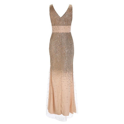 Elegant floor-length gown with a deep V-neckline, featuring a gold sequined bodice and gradient into a peach skirt. The dress exudes glamour and sophistication.