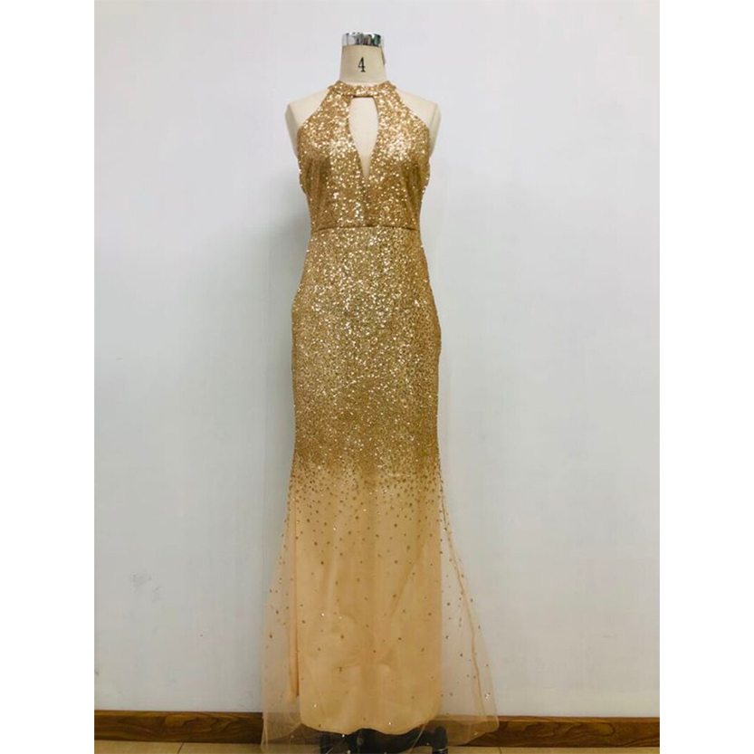 Elegant golden dress on a mannequin, embellished with shimmering sequins and a keyhole neckline. The floor-length gown exudes a glamorous, formal vibe.
