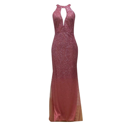 Elegant long pink dress with a fitted silhouette, glittering fabric, and a keyhole neckline. The gown exudes a glamorous and sophisticated tone.