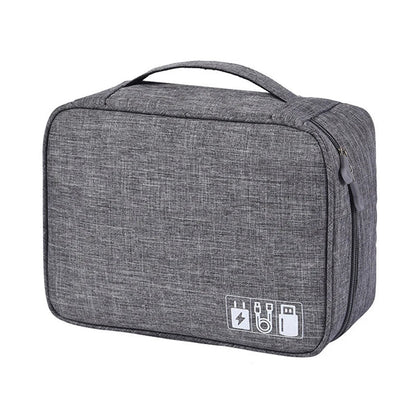 Gray accessory organizer bag with a sturdy handle and icons for charging cables, designed for travel and convenience.