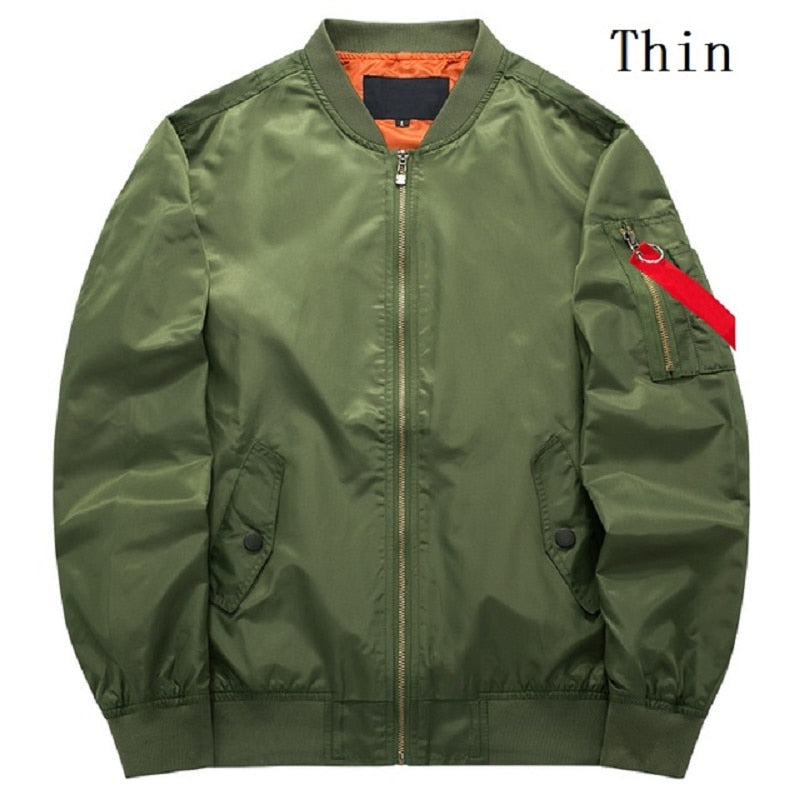 Green bomber jacket with orange lining and front zipper. Features a red tag on the sleeve pocket, giving a sleek and modern style.