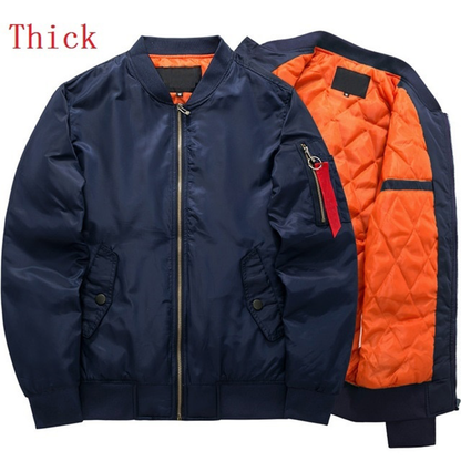 Navy bomber jacket with orange quilted lining. Features a front zip, side pockets, and sleeve pocket with red tag. Label reads "Thick."