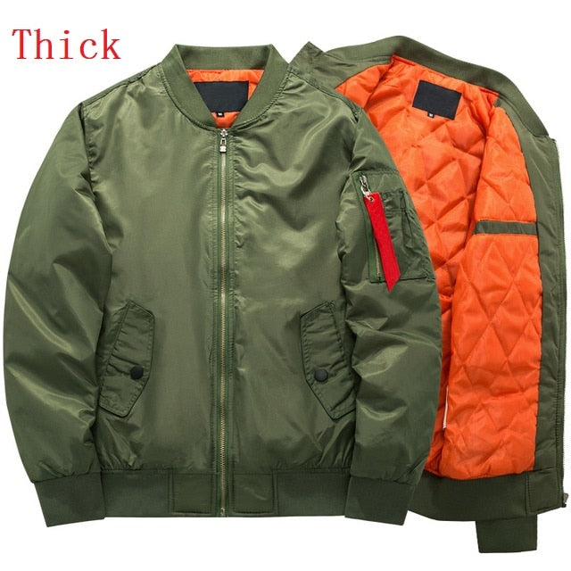 Olive green bomber jacket with orange quilted lining, zipped front, and a small red pocket detail on the sleeve. Text reads "Thick."