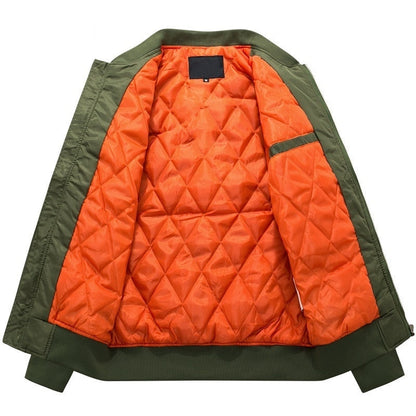 Olive green jacket with a vibrant orange quilted lining, displayed open. The design is modern and utilitarian, providing a stylish contrast.