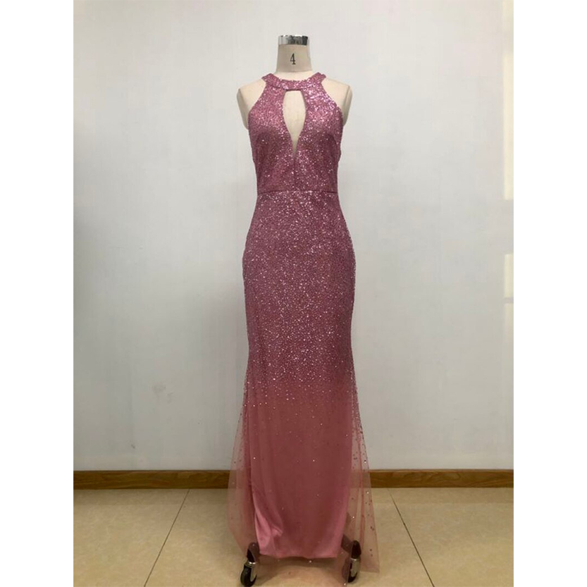 Pink sequined evening gown on mannequin; features a keyhole neckline and fitted silhouette, exuding elegance and glamour against a plain backdrop.
