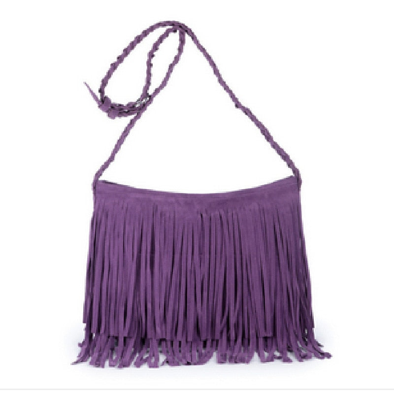Purple suede fringe shoulder bag with a braided strap and a stylish bohemian design. Perfect for casual outings.