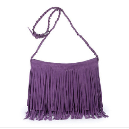 Purple suede fringe shoulder bag with a braided strap and a stylish bohemian design. Perfect for casual outings.
