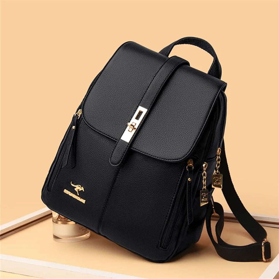 Stylish black backpack with gold accents, featuring a flap closure and side zippers, set against a warm beige background.