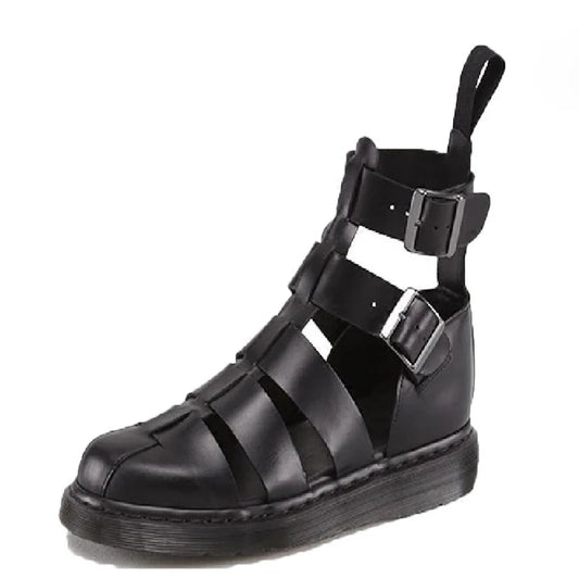 Black gladiator-style sandal with multiple straps, a thick sole, and a pull tab at the back, photographed against a white background.