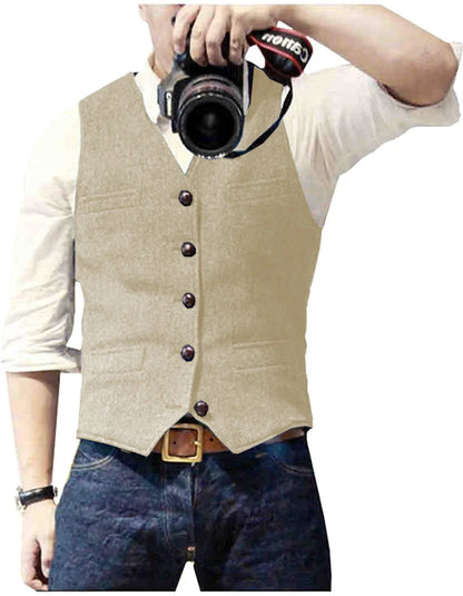 A man wearing a beige vest over a white shirt, holding a camera, ready to capture photos.