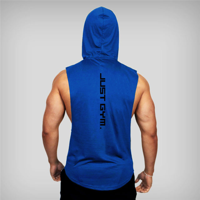 A muscular man in a blue sleeveless hoodie faces away, featuring the text "JUST GYM." down the back.