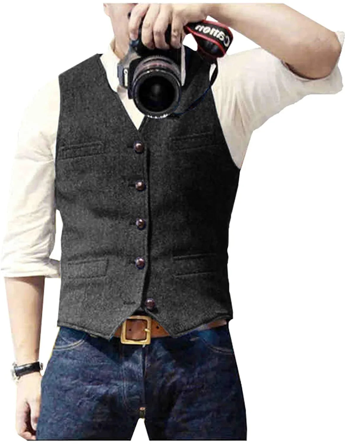 Man in a gray vest with buttons and pockets, holding a camera and taking a photo against a white background. Casual style.