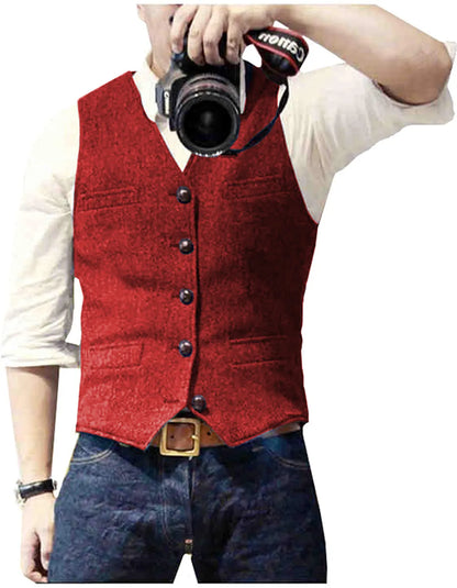 A person wearing a red vest over a white shirt, holding a camera with a Canon strap, capturing a moment.