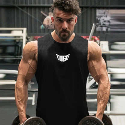 A muscular person in a sleeveless black shirt holds dumbbells in a gym, showcasing strength and dedication to fitness.