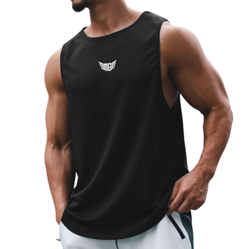 A muscular man wearing a sleeveless black tank top with a logo stands confidently, hands in pockets, showcasing a sporty look.
