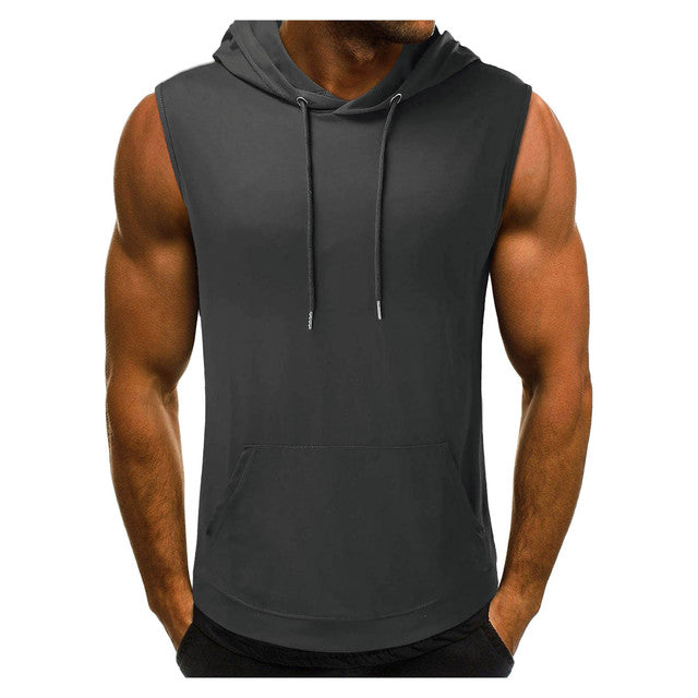 Muscular man wearing a sleeveless dark gray hoodie with a front pocket. The hoodie has a drawstring, conveying a casual and athletic vibe.