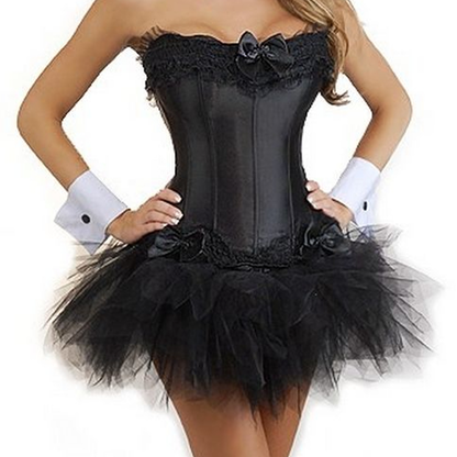 A woman wearing a strapless black corset with lace details, a black tulle tutu skirt, and white cuffs. The outfit conveys a playful and stylish tone.