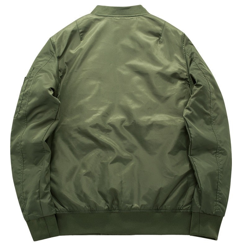 A green bomber jacket shown from the back, featuring a shiny, smooth fabric with ribbed cuffs, waistband, and collar, conveying a casual style.