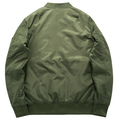 A green bomber jacket shown from the back, featuring a shiny, smooth fabric with ribbed cuffs, waistband, and collar, conveying a casual style.