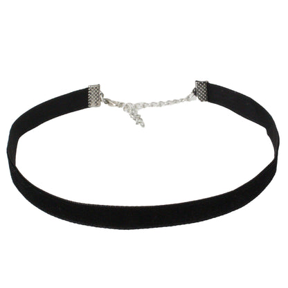A black velvet choker necklace with silver end clasps and an adjustable chain is displayed against a white background, conveying a simple, elegant style.