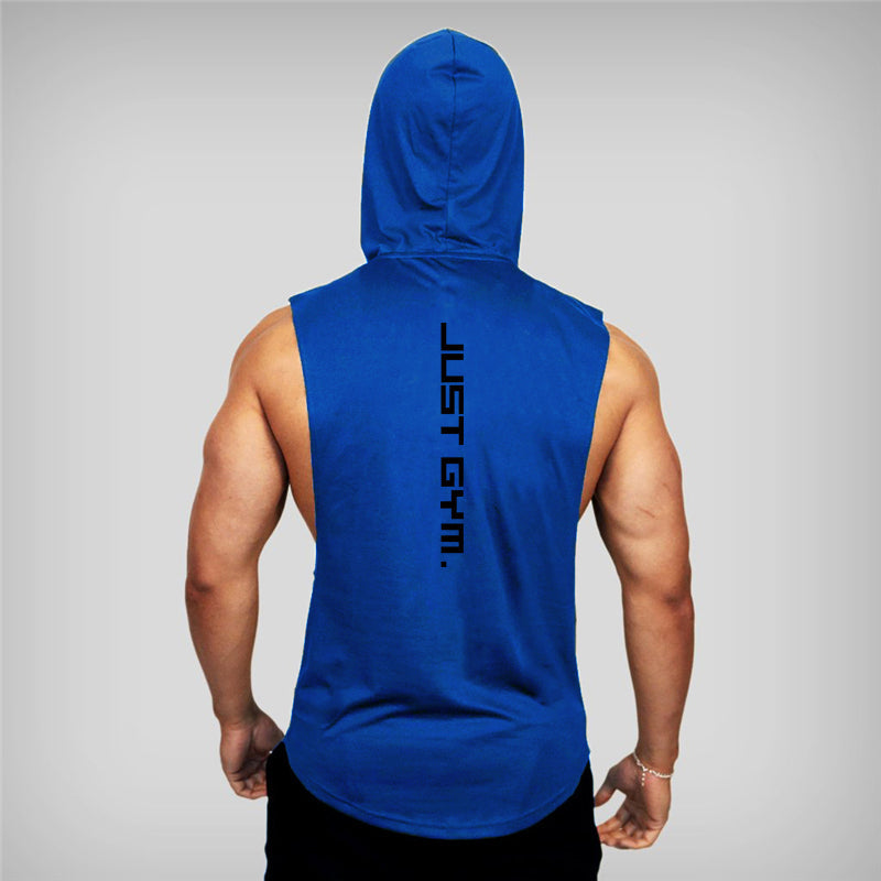 A muscular person in a blue sleeveless hoodie with "JUST GYM." printed vertically on the back, viewed from behind against a gray background.