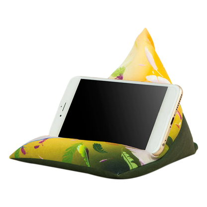 A colorful phone holder shaped like a pyramid, supporting a smartphone at an angle, featuring floral designs in yellow and green.