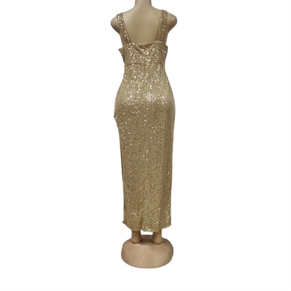 A back view of a mannequin wearing a long, gold sequin dress. The dress has wide shoulder straps and a fitted silhouette, exuding elegance.