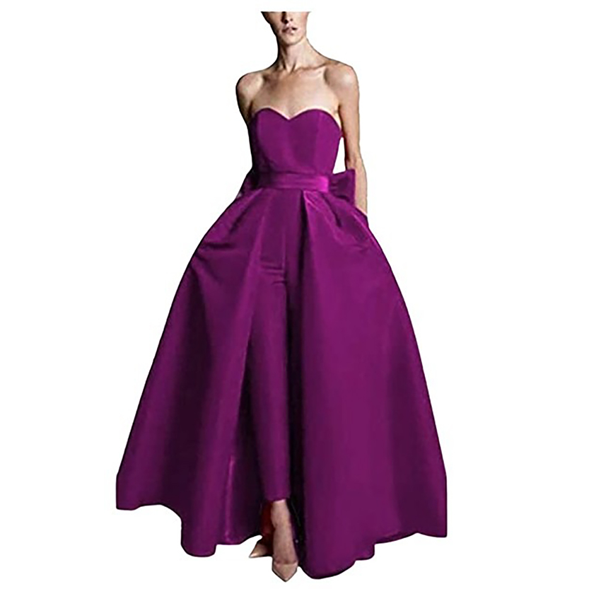 A woman wearing a heart-shaped neckline magenta dress with a full, flowing skirt. The elegant gown conveys sophistication and style.