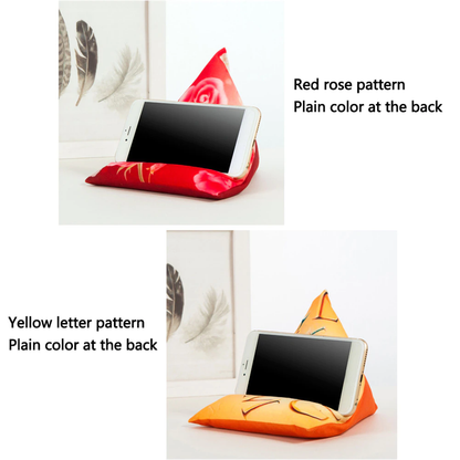 Two smartphone stands are displayed: one with a red rose pattern and another with a yellow letter pattern, both featuring plain backs.