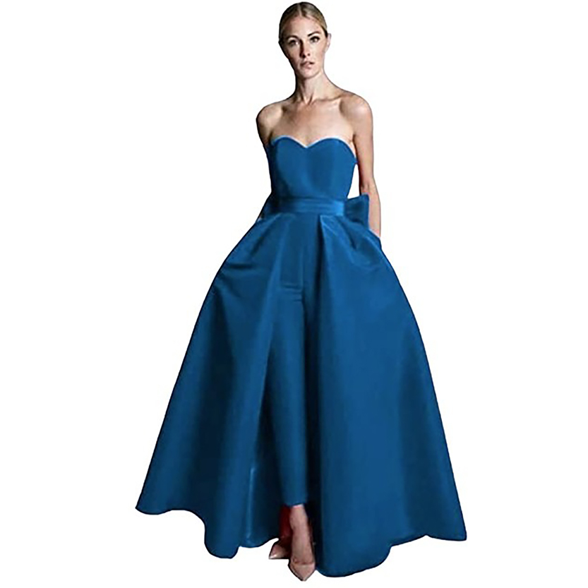 A woman in an elegant, strapless blue ball gown with a sweetheart neckline poses against a white background. The dress has a structured, flowing skirt.
