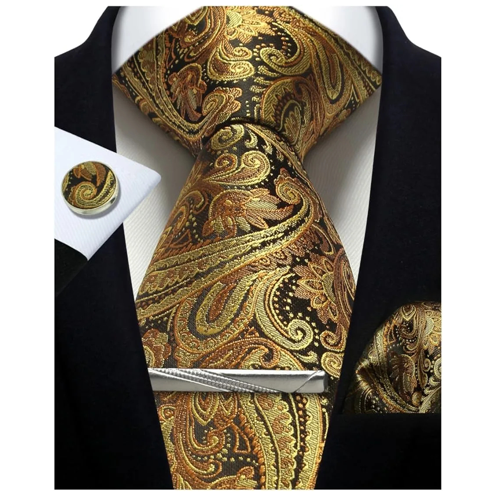 Gold and black paisley tie set with matching pocket square and cufflinks on a white background.